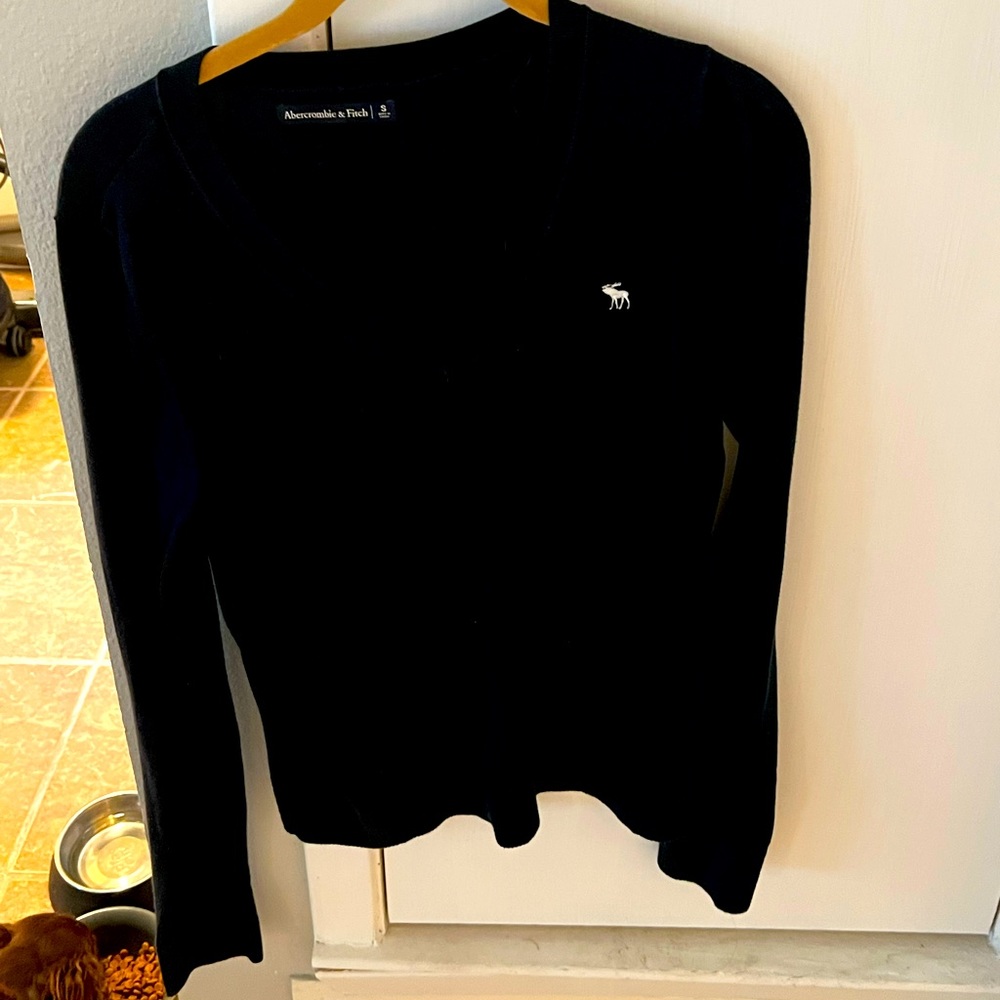 Blue lightweight navy v neck sweater, white moose. Worn gently